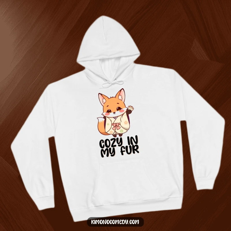 Funny Hoodie: A cheerful fox in a flowing kimono waves warmly, offering comfort and a touch of woodland humor.
