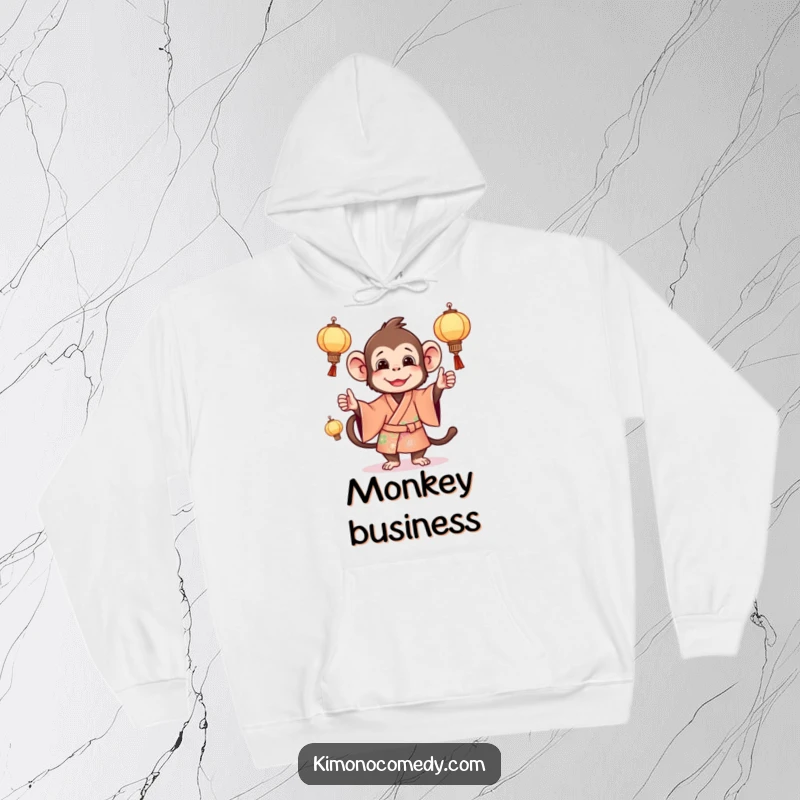 Funny monkey hoodie showcasing a lively primate in a bright kimono, juggling miniature lanterns with cheerful energy.