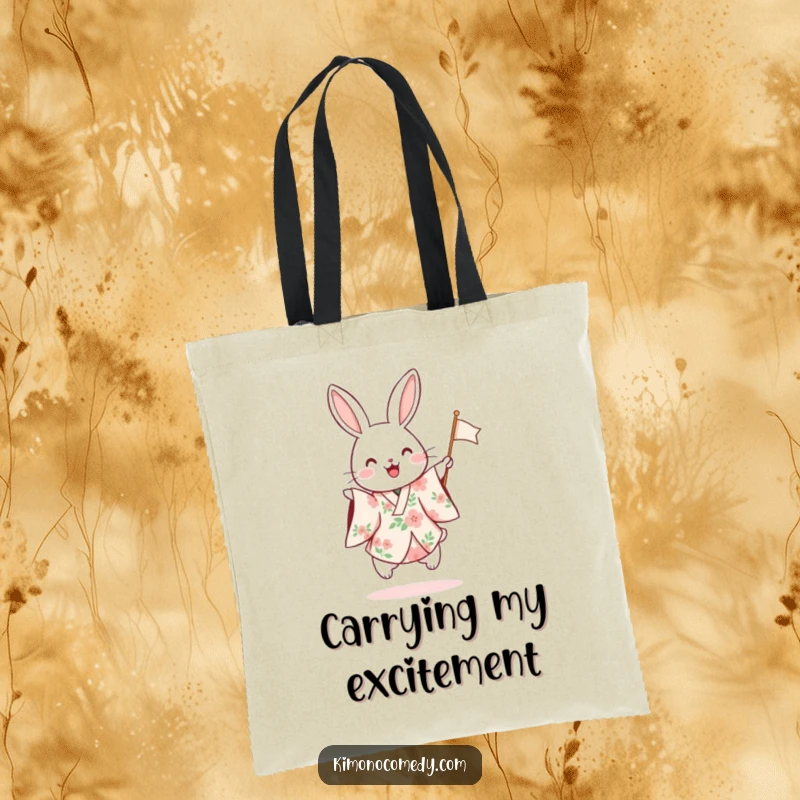 Funny tote bag showcasing a rabbit in a floral kimono hopping excitedly and waving a small flag, perfect for carrying festive items.